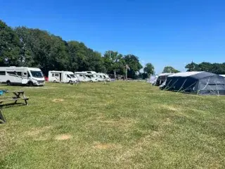Row of motorhomes playground field