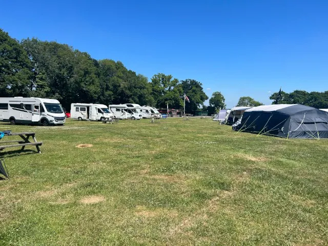 Row of motorhomes playground field